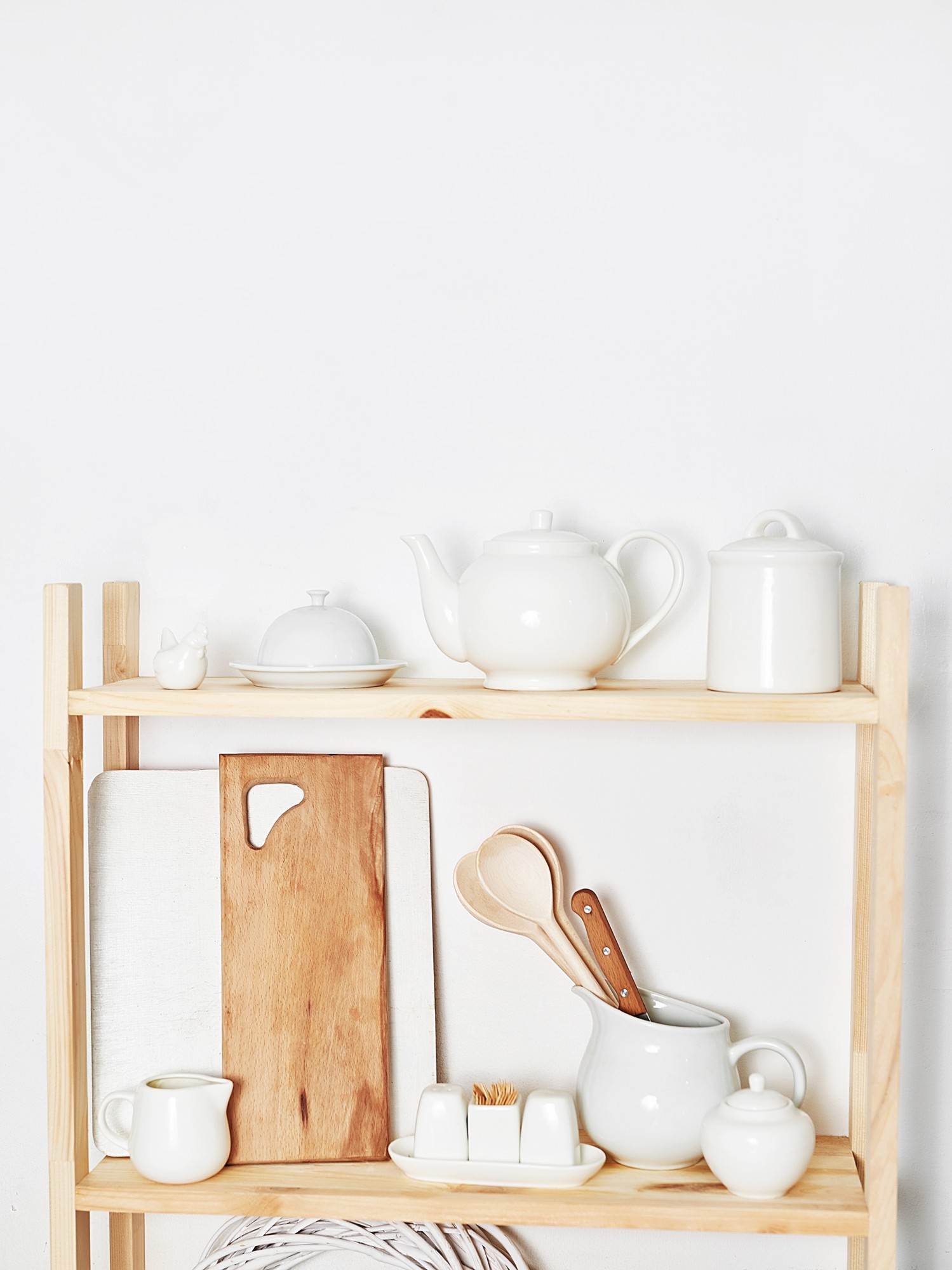 Compact studio kitchen with natural light and utensils